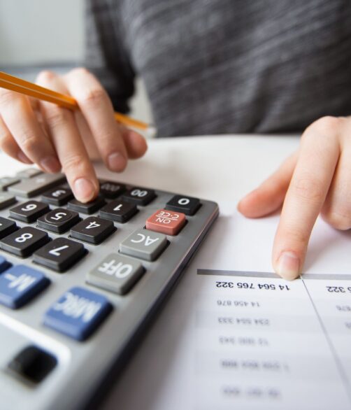 closeup-accountant-hands-counting-calculator (1)