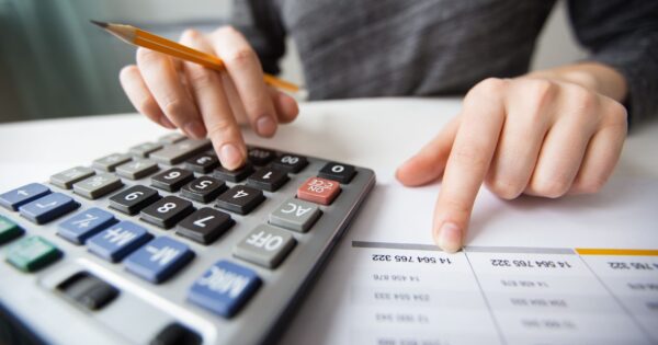 closeup-accountant-hands-counting-calculator (1)
